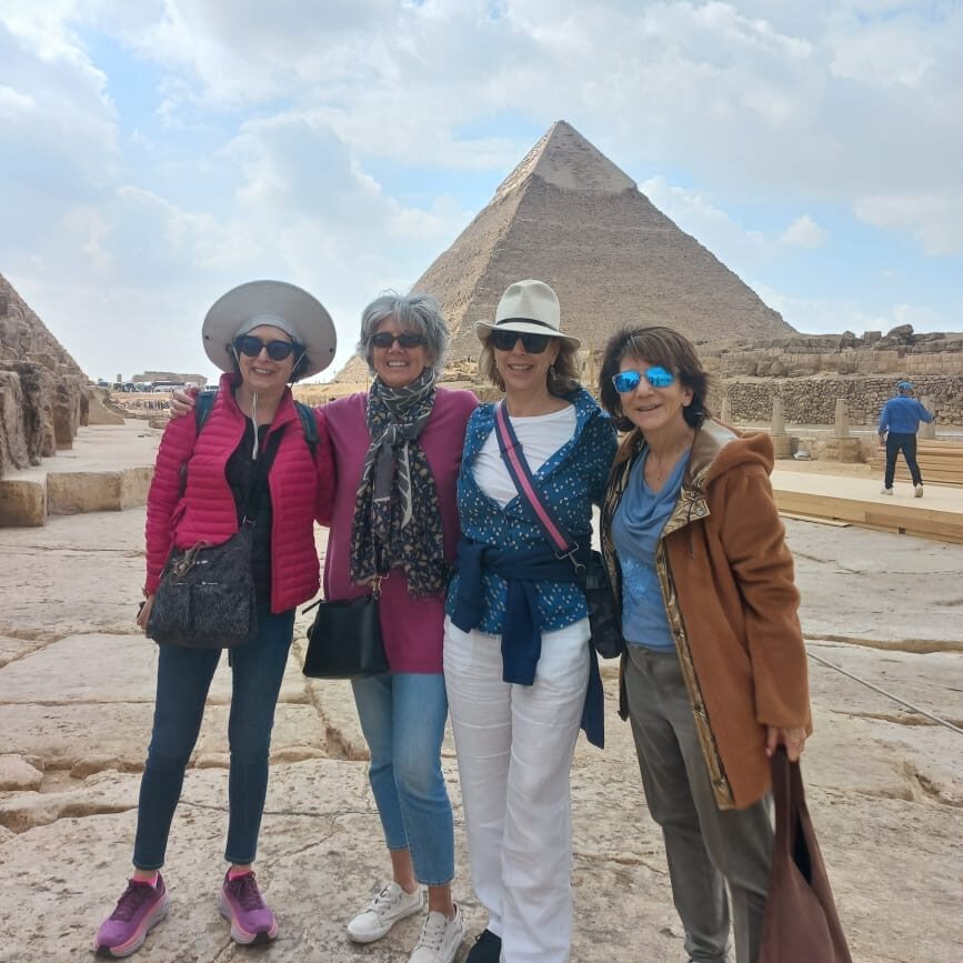 4 solo female travelers at the pyramids with EGYPT FOR AMERICANS